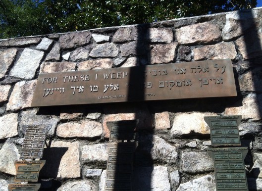 This metal plaque is inscribed in both English and Yidish. "For these I weep..." Is from Lamentations 1:16 of the Old Testament.