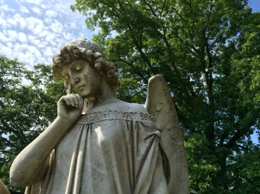By contrast, this angel seems more forlorn and pensive than the first one. Still, the detail of the lace edge of her gown is eye-catching.