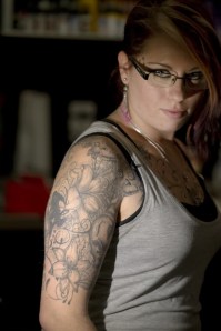 Tattoo artist Kystal Borsa shows a tribute tattoo on her shoulder made from ink mixed with the ashes of her late mother Rose Borsa, who died when Krystal was 11 years old. Photo courtesy of Peter J. Thompson/National Post.