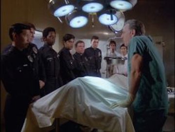 One of my favorite intro scenes on Quincy was when the young police recruits pass out as he begins an autopsy. Photo courtesy of TVRage.