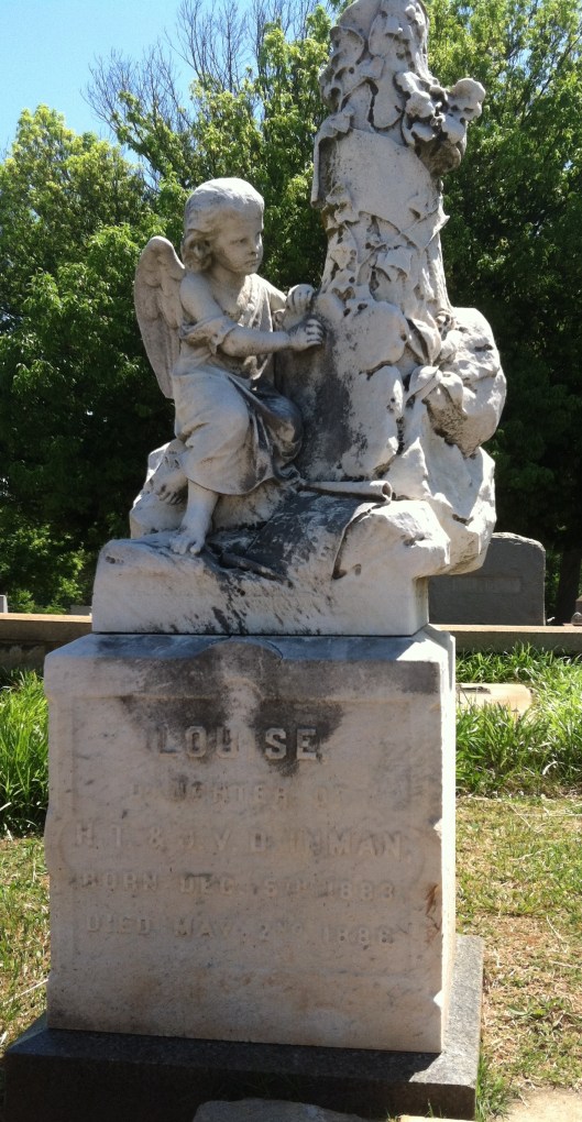 Another cherub leans against a tree on this marker. Louise is buried at Oakland Cemetery in Atlanta, Ga.