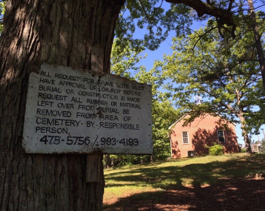 This rustic cemetery sign spells out the rules. I see many of these old faded signs at cemeteries like this.