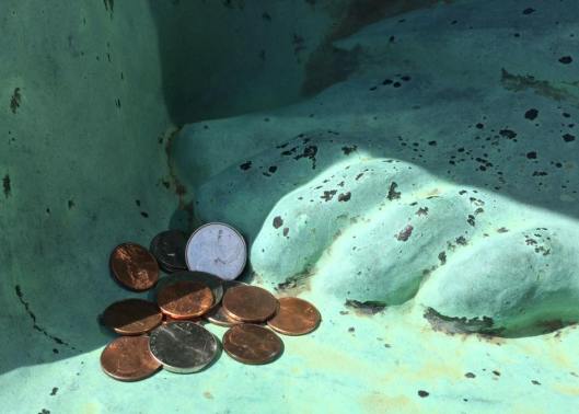 Visitors like to leave coins at the feet of the "Eternal Silence" statue. Are they perhaps paying the ferryman to guide them over the River Styx?