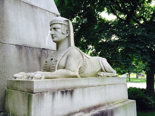 A male Sphinx guards the door.