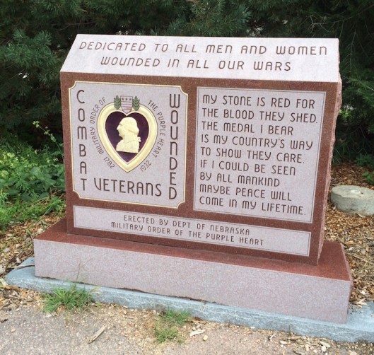 This red granite monument is inscribed with a replica of the Purple Heart, America’s traditional medal awarded to military personnel wounded in combat. Congress provided one of these monuments to each state in the Union and Wyuka was chosen as Nebraska’s location.