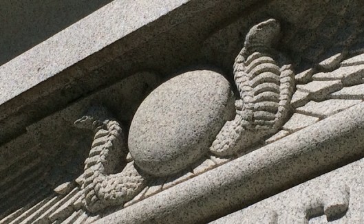 The symbols of the winged disc, cobra and wings are connected to Freemasonry.