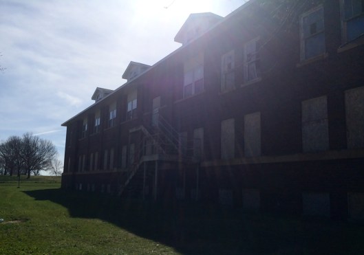 A side view. More broken windows and rusty stairways.
